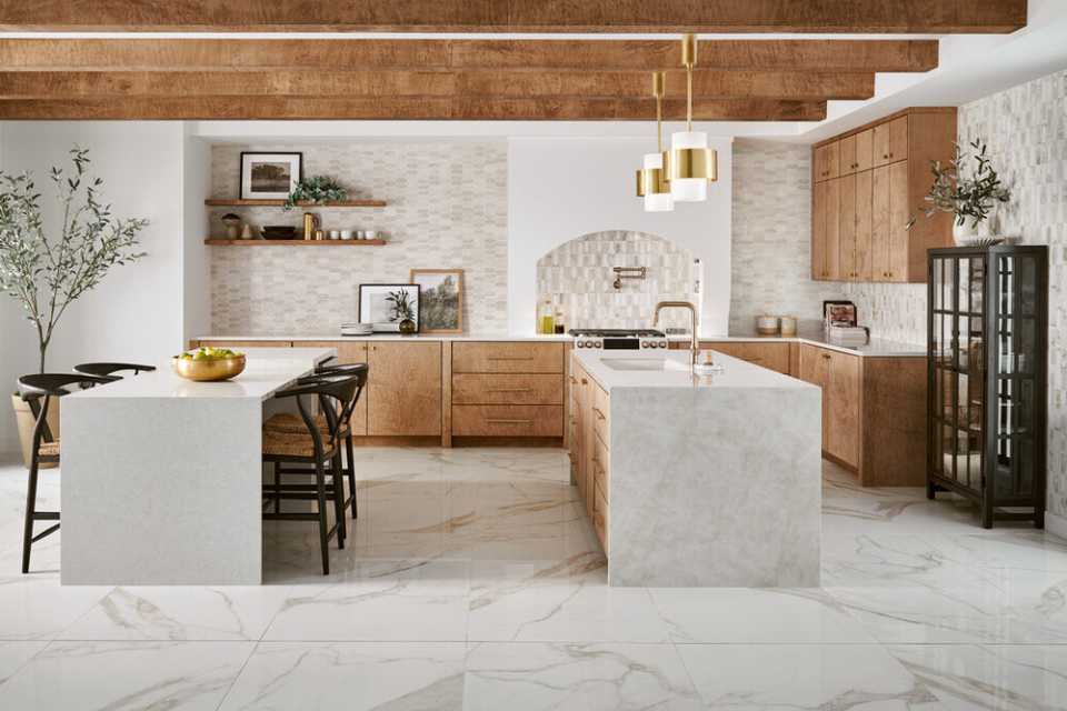 open, airy Mediterranean style kitchen with wooden beams, greenery and marble floors